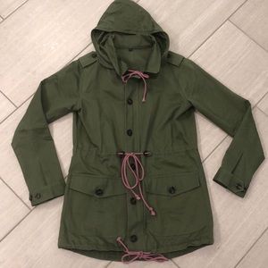 Green colored long coat with hood.